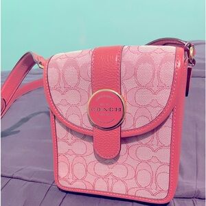 A pink coach crossbody bag and in excellent condition. NWOT